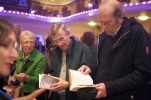 Audience browsing books at Festival