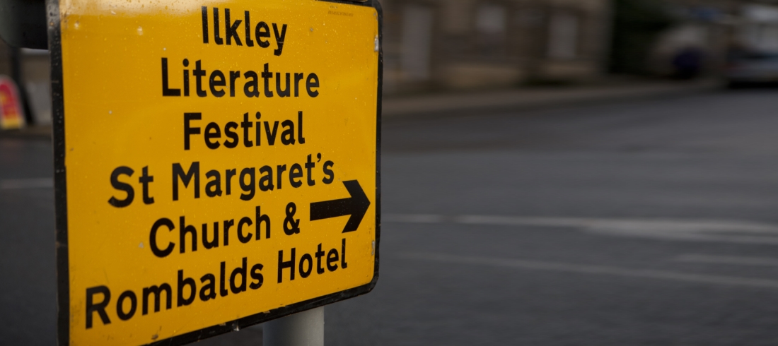 Yellow AA road sign showing way to Festival venue